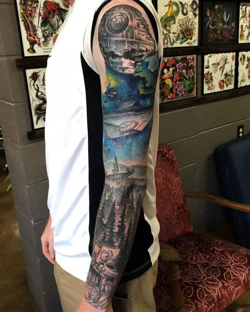 Colourful full sleeve tattoo with the Death Star and the Battle of the Planet