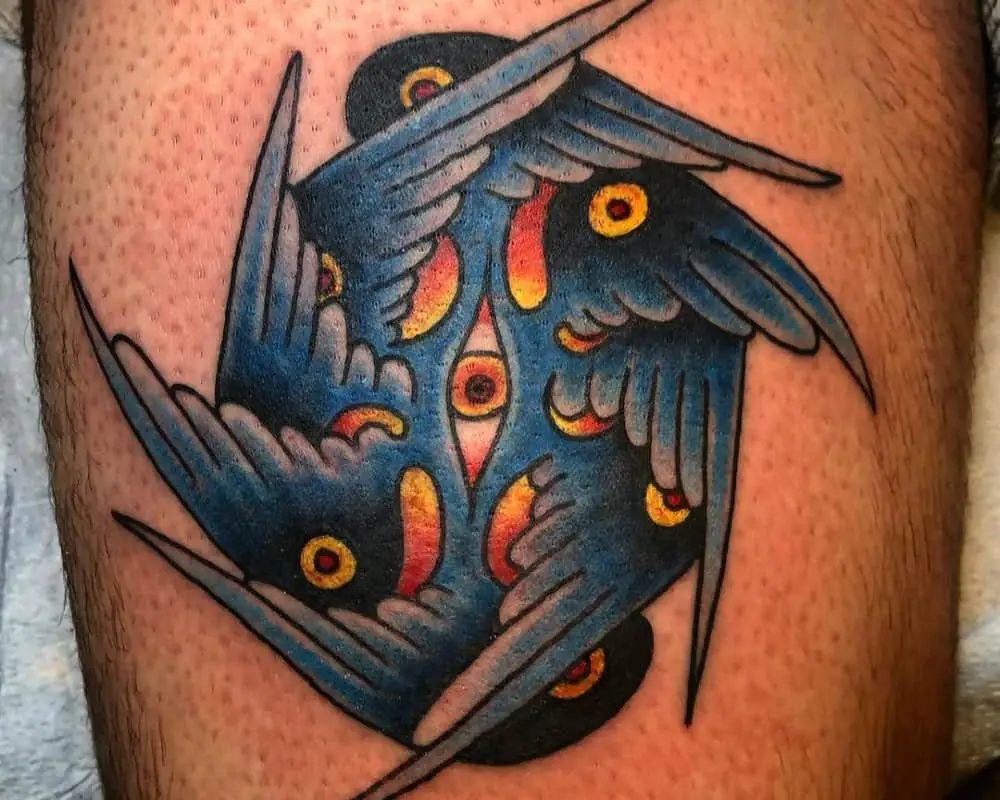 Colourful tattoo of an angel with four pairs of wings and eyes