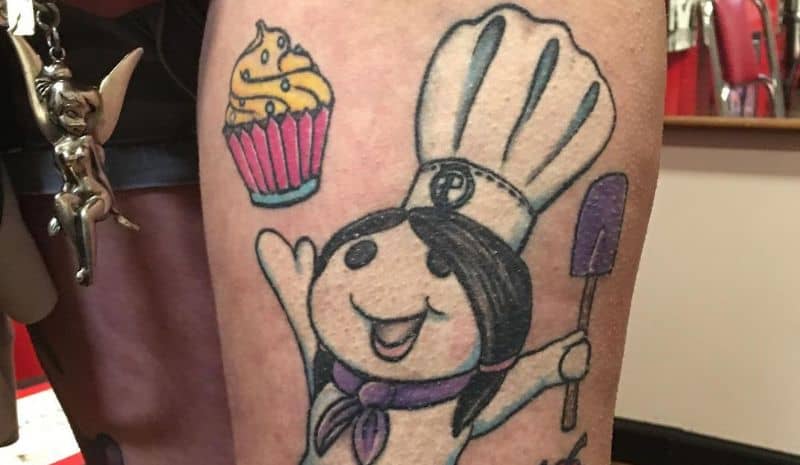 Outline cook and yellow and pink cupcake tattoo