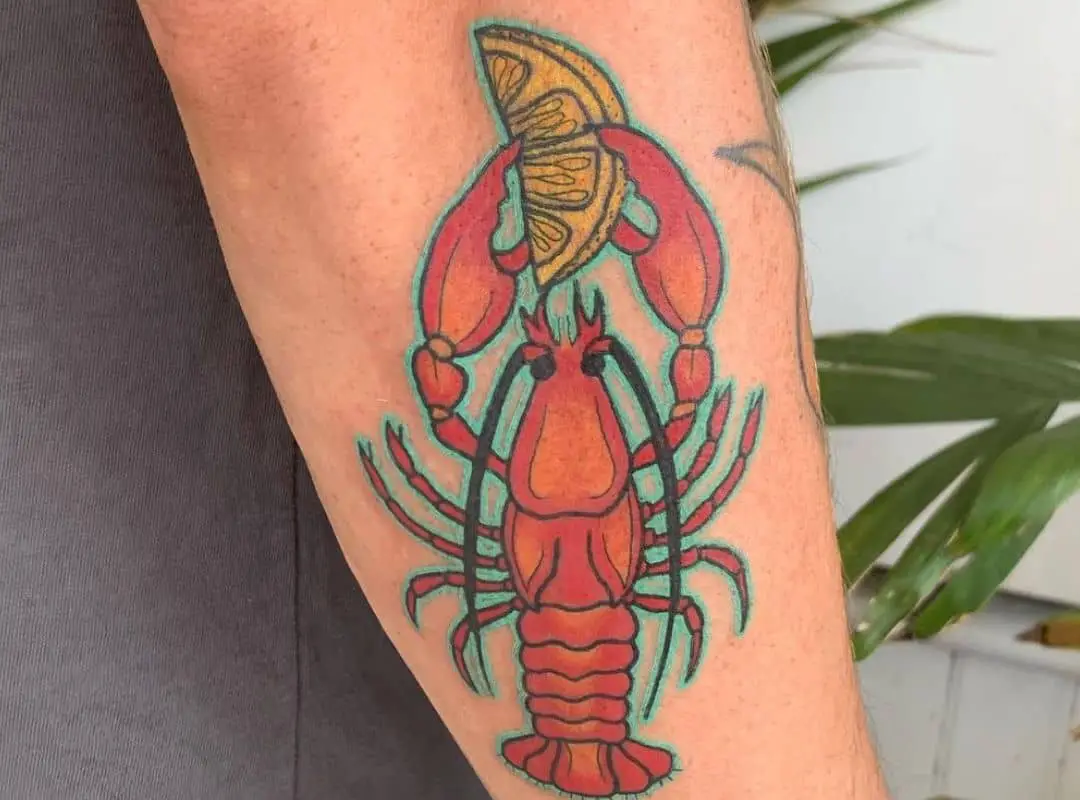 Crawfish with lemon in the claws tattoo