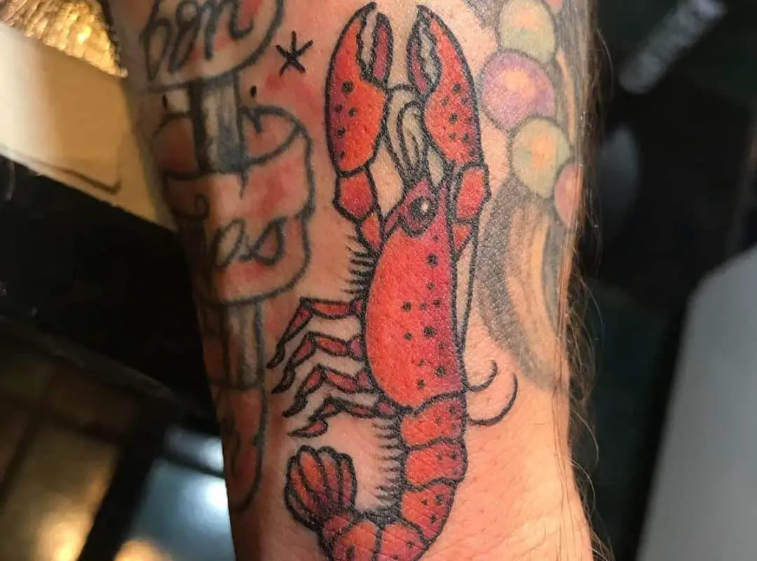 Crawfish with other tattoos around 