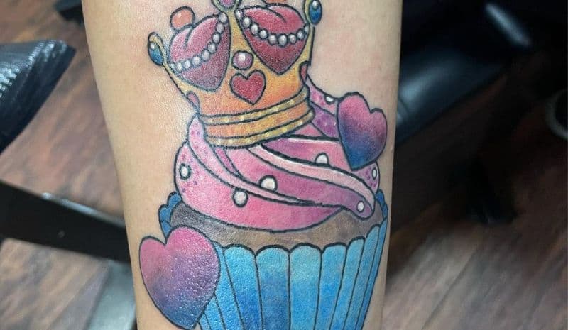 Pink and blue cupcake with crown tattoo