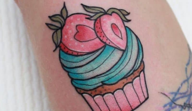 Blue and pink cupcake with strawberry tattoo