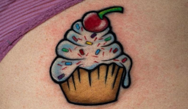 Cupcake with cherry and sprinkles tattoo