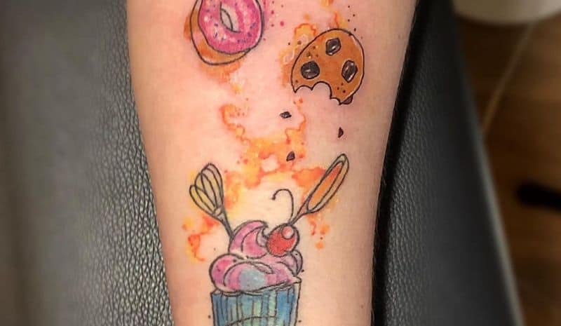 Cupcake with whisk and knife tattoo