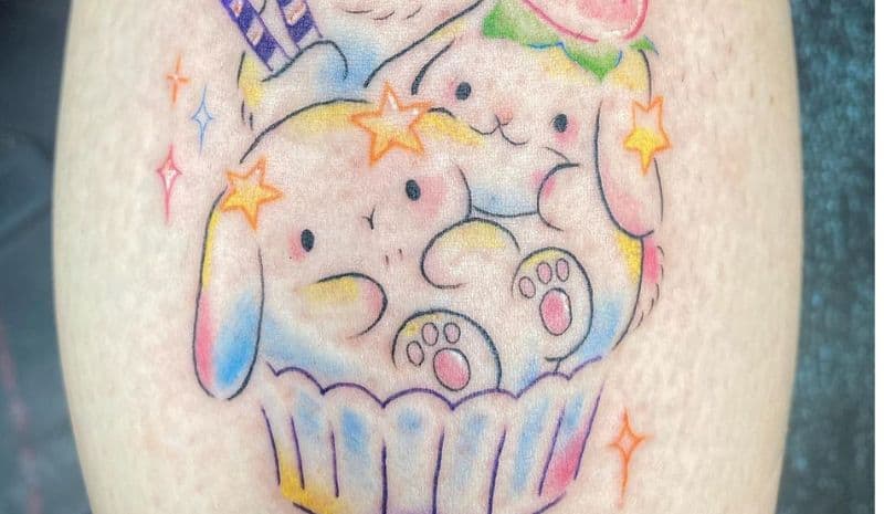 Colorful cupcake with rabbits and stars tattoo