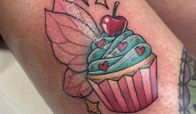 Cupcake with wings and cherry tattoo