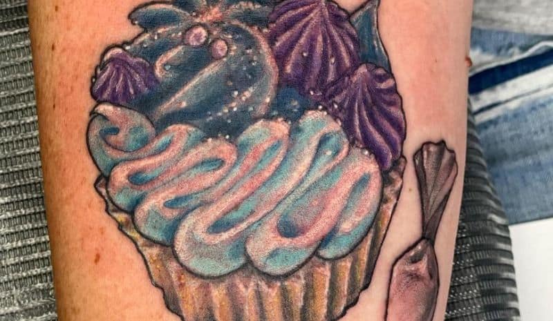 Cupcake with blue and purple cream tattoo