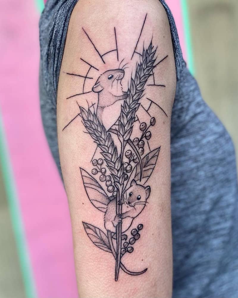 Cute tattoo and spikelets of wheat and two mice on them