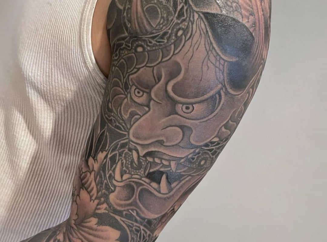 Demon with flowers tattoo