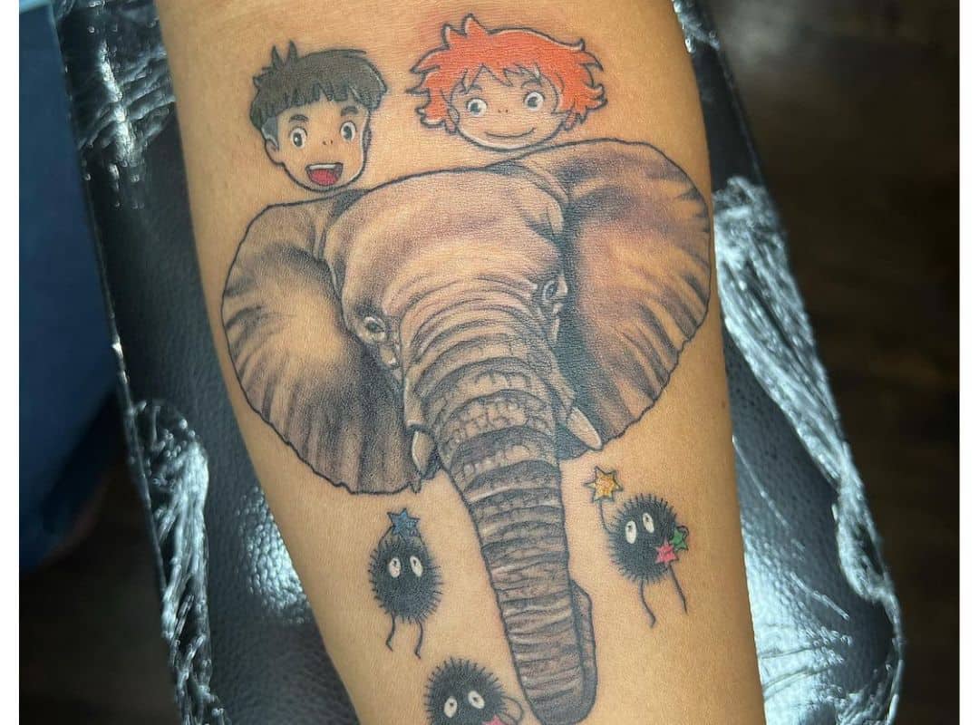 Heads of Sosuke and Ponyo over the elephant tattoo