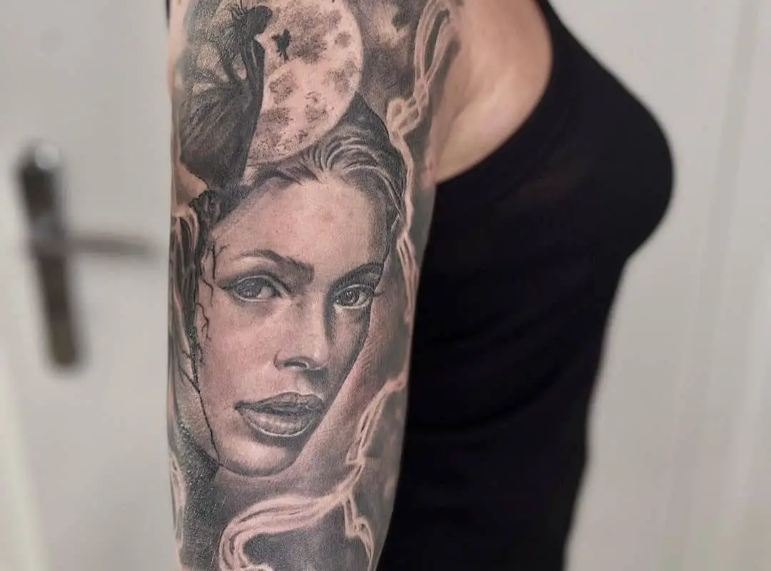 Woman face on space and waves tattoo