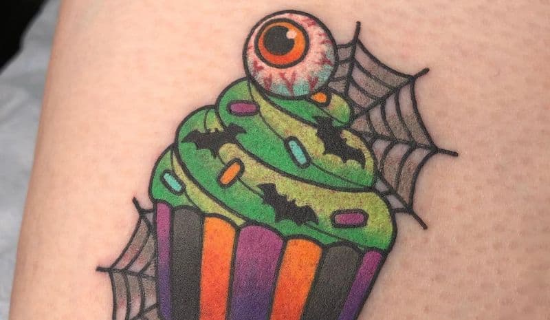 Cupcake with green cream and eye tattoo