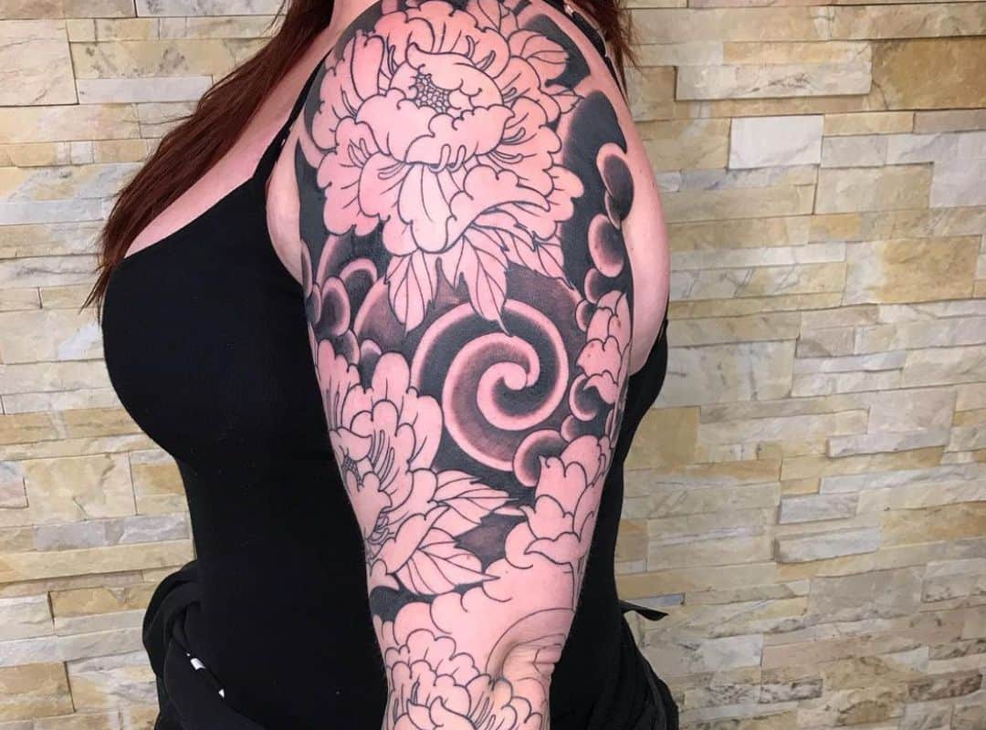 Floral design on the black clouds tattoo