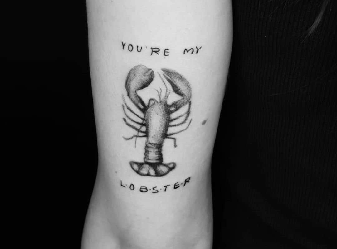 Black lobster with sign tattoo
