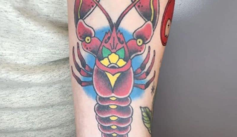 Big lobster with flower in the centre tattoo