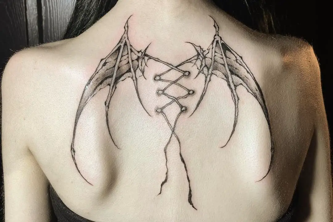 Gothic wing tattoo on the back