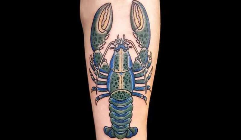 Green and blue lobster with big claws tattoo