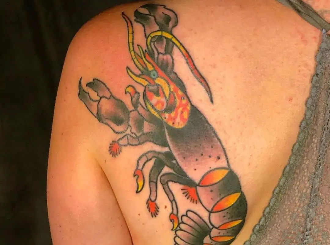 Grey&yellow crawfish back tattoo