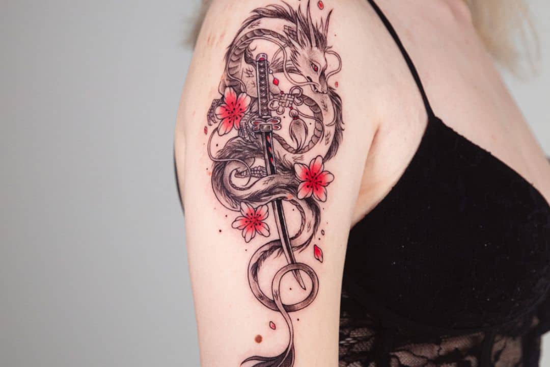 Haku with the sword and flowers around tattoo