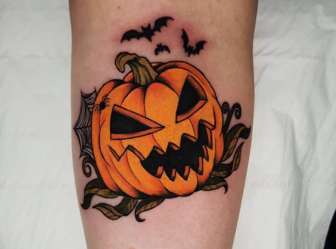 Scary Halloween pumpkin with the bats tattoo