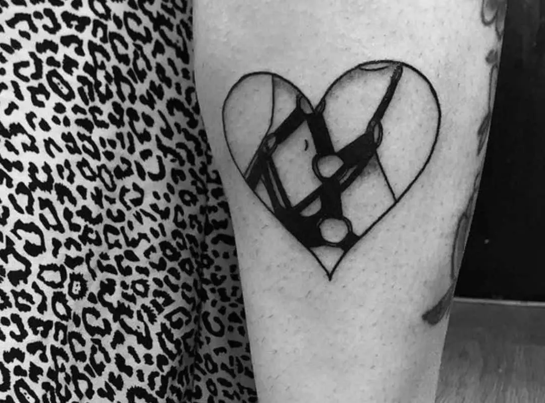 Heart with straps in the centre tattoo