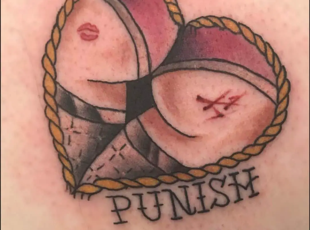 Heart with ass in the centre tattoo