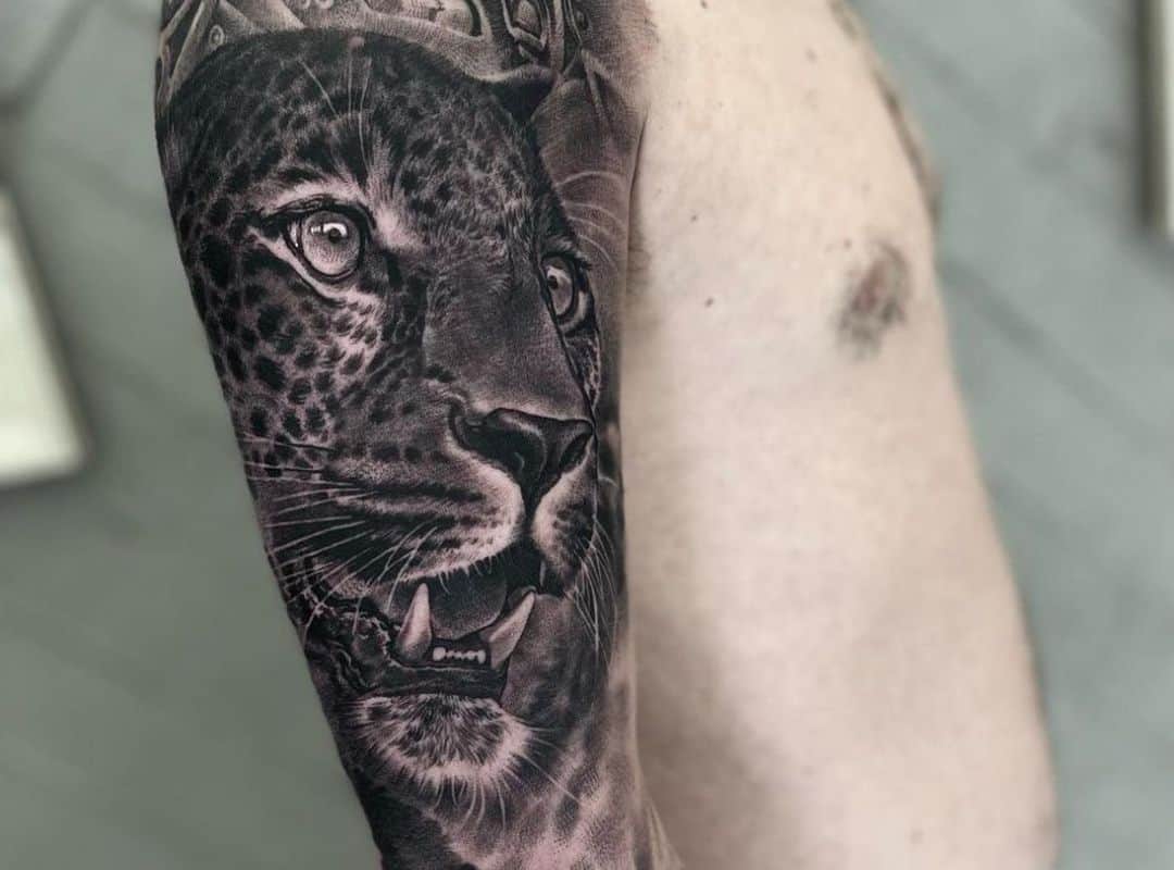 Black and grey leopard tattoo