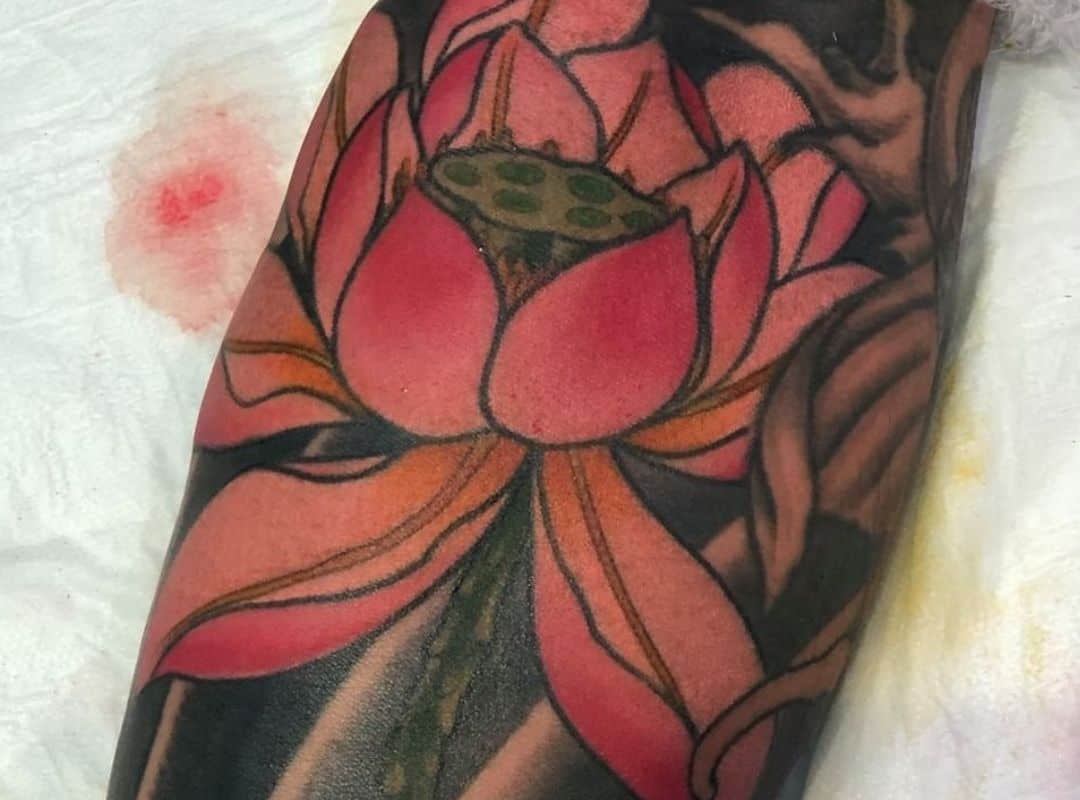 Lilies on black background tattoo