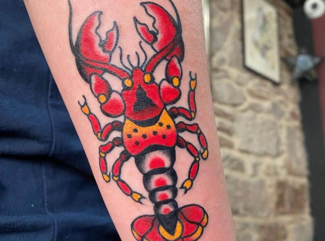 Black, yellow and red lobster tattoo