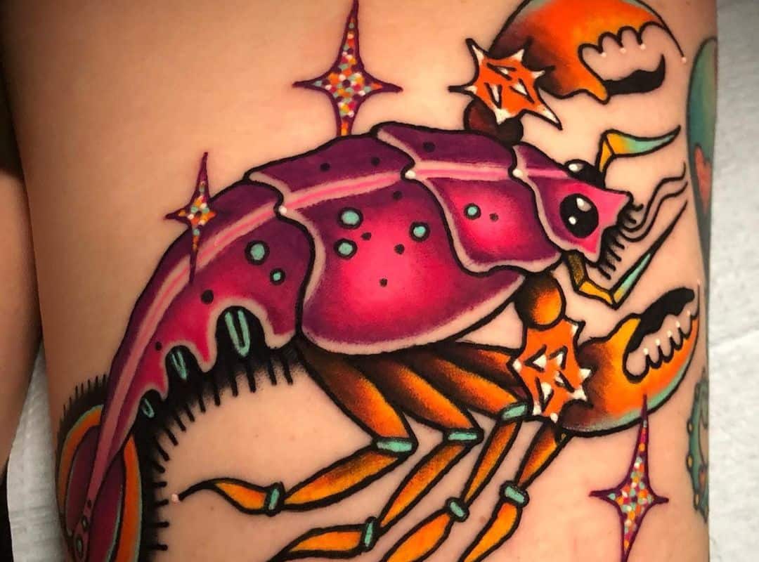 Big yellow and red lobster with stars around tattoo
