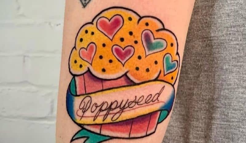 Muffin with sign and hearts tattoo