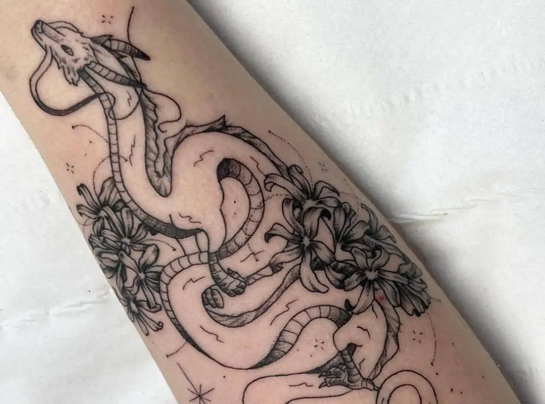 Outline Haku dragon with flowers tattoo