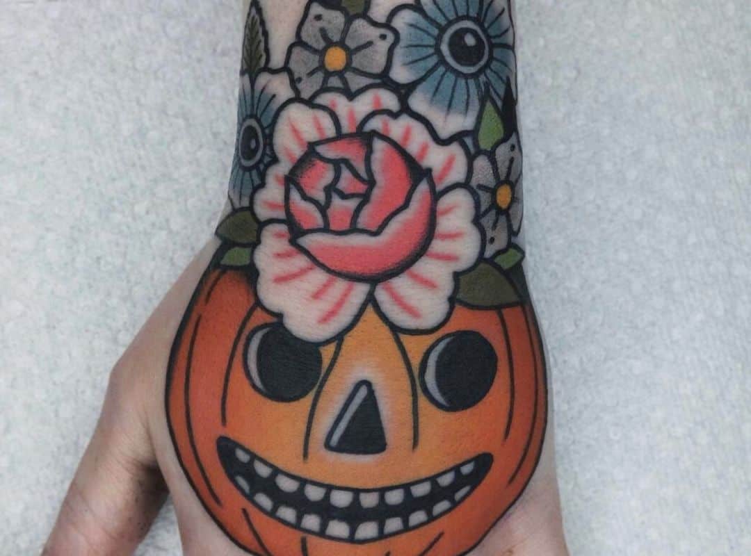 Pumkin with flowers on the head tattoo