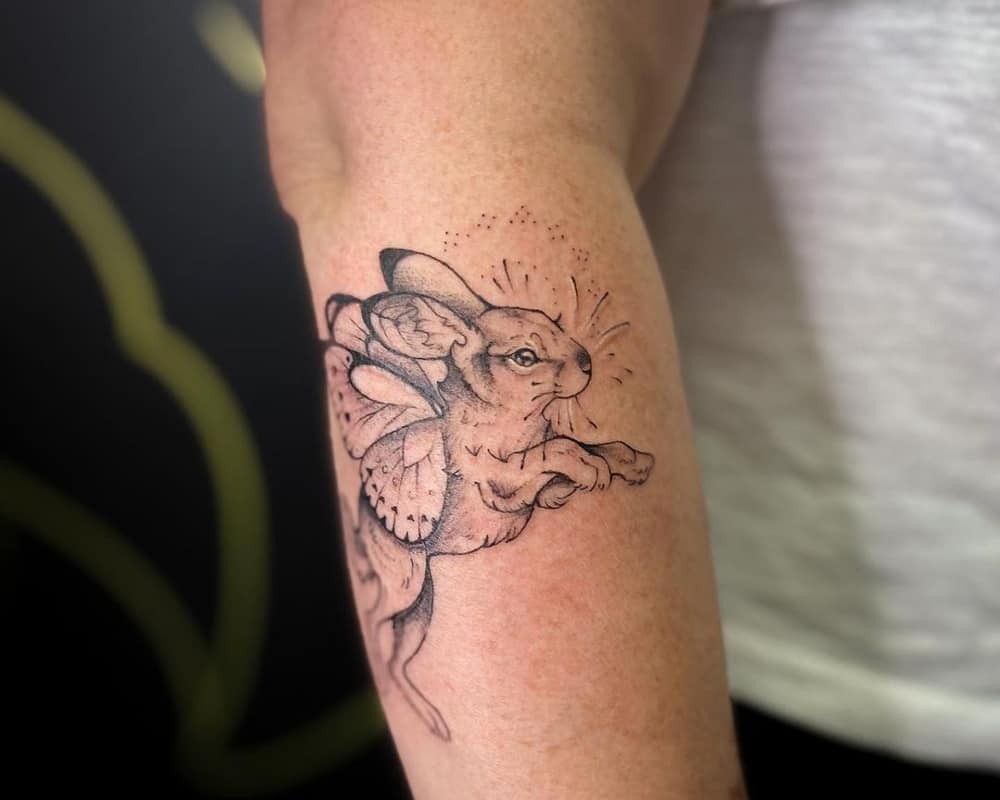 Rabbit tattoo with butterfly wings