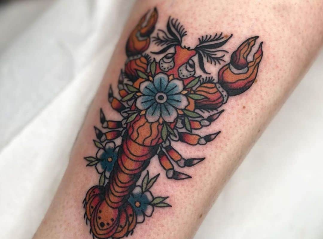Red lobster with flower in the centre tattoo