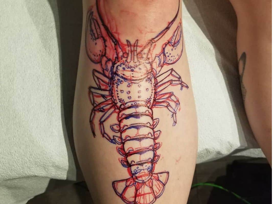 Red outline lobster leg tattoo