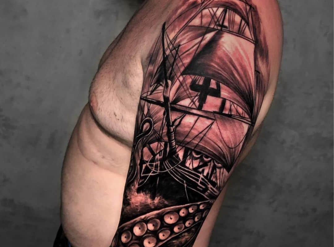 Ship in black and red colors tattoo