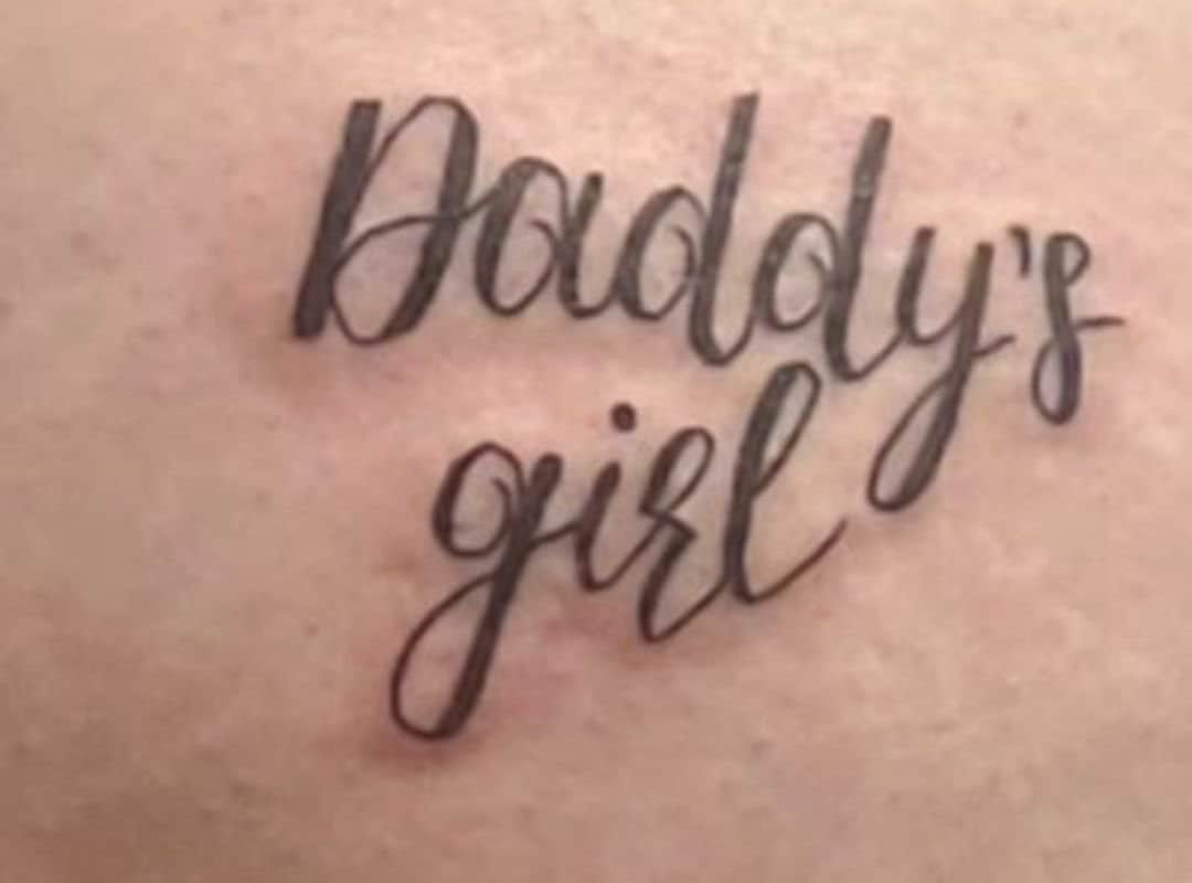 Sign "Daddy's girl" leg tattoo