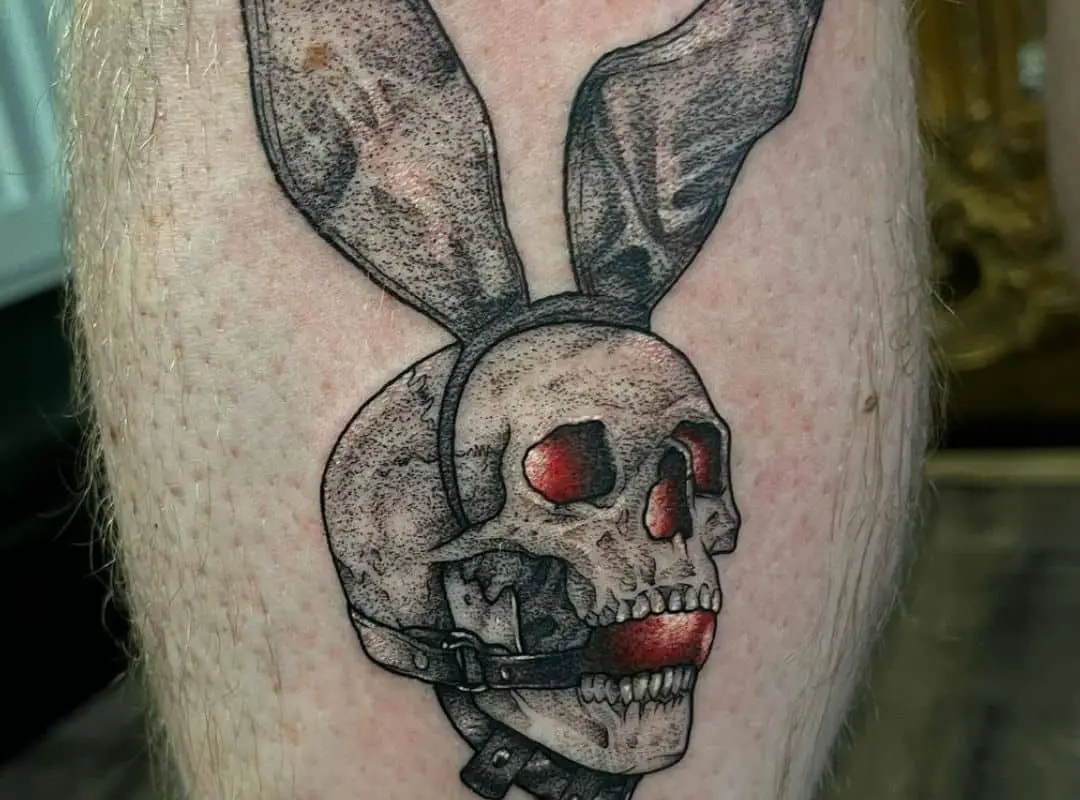 Skull with bunny ears tattoo