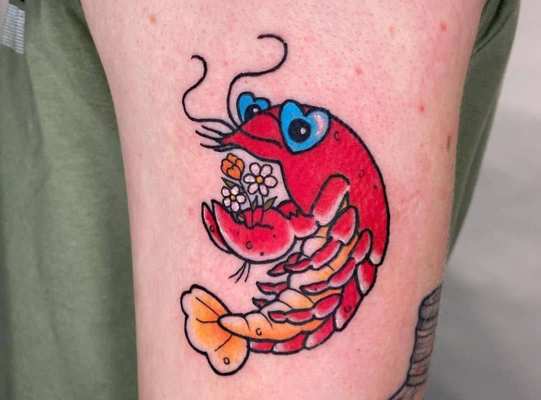 Small lobster with flowers in the claws tattoo