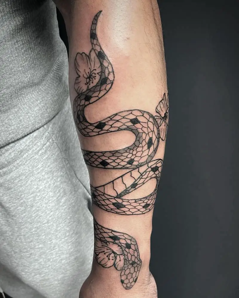 Snake tattoo with flowers