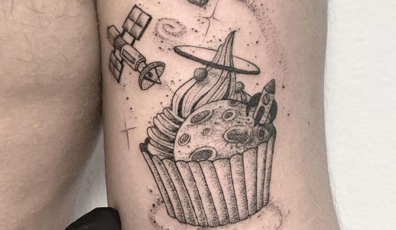 Outline space cupcake tattoo