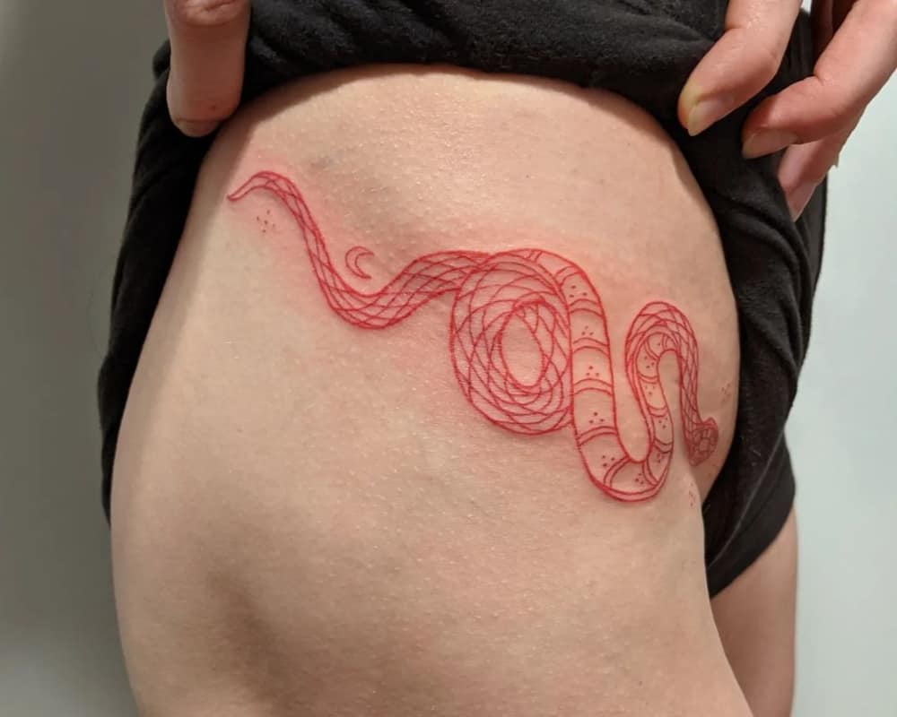 Tattoo a red snake on your thigh