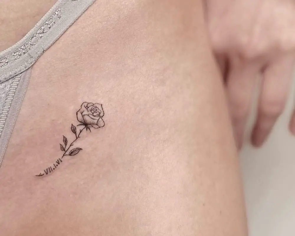 Tattoo a small rose and date