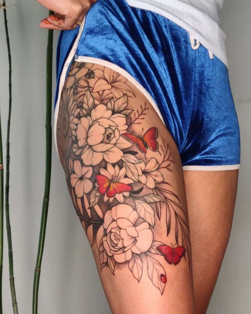Tattoo in the form of a bouquet of flowers and butterflies on it