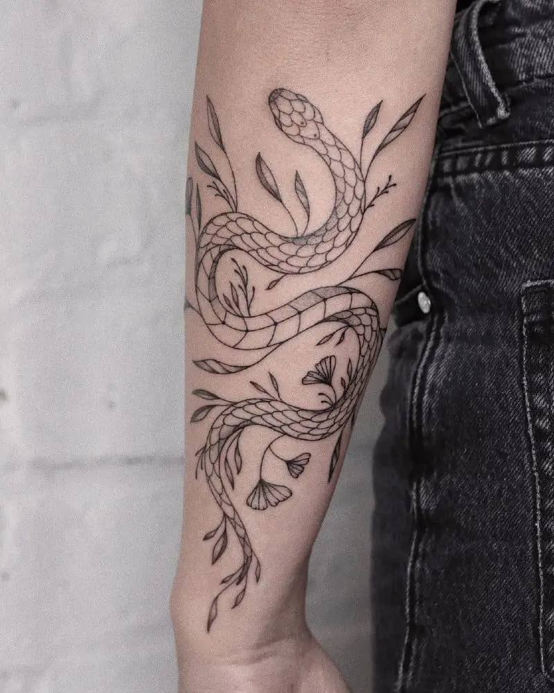 Tattoo in the form of a snake and plants