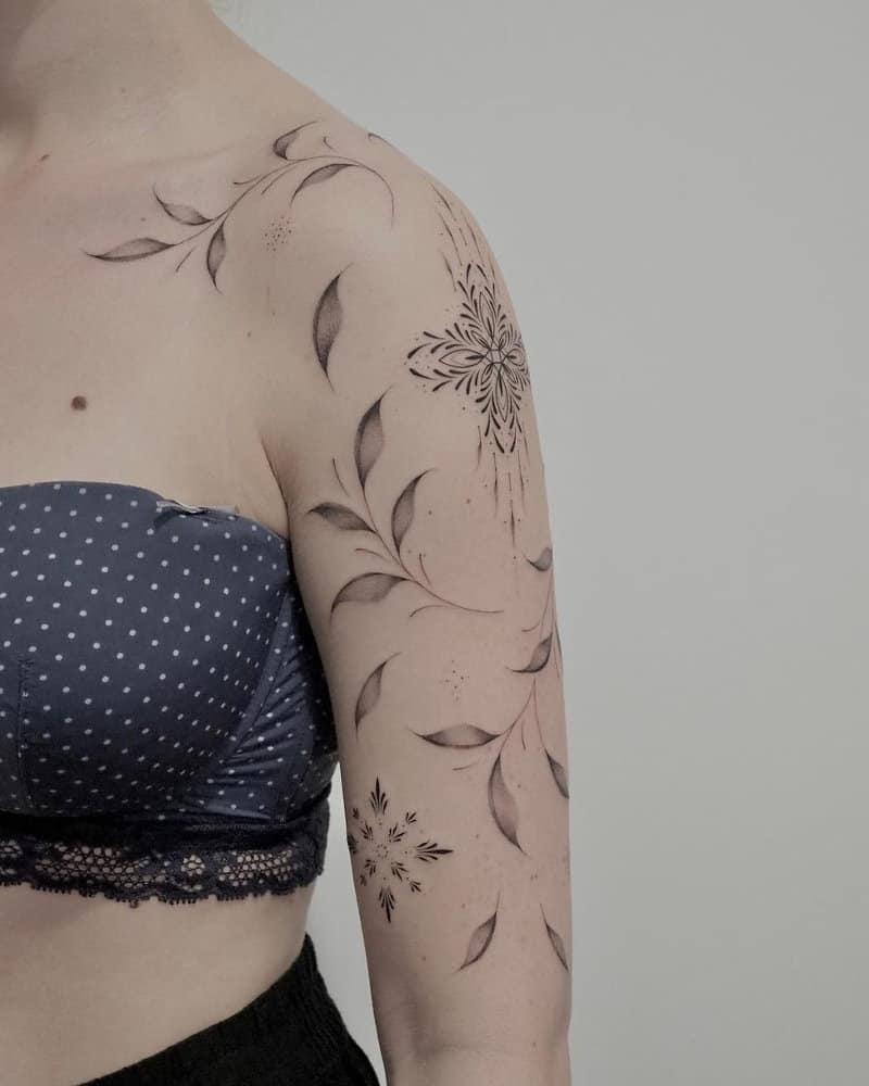 Tattoo in the form of leaves and rhombuses with a pattern