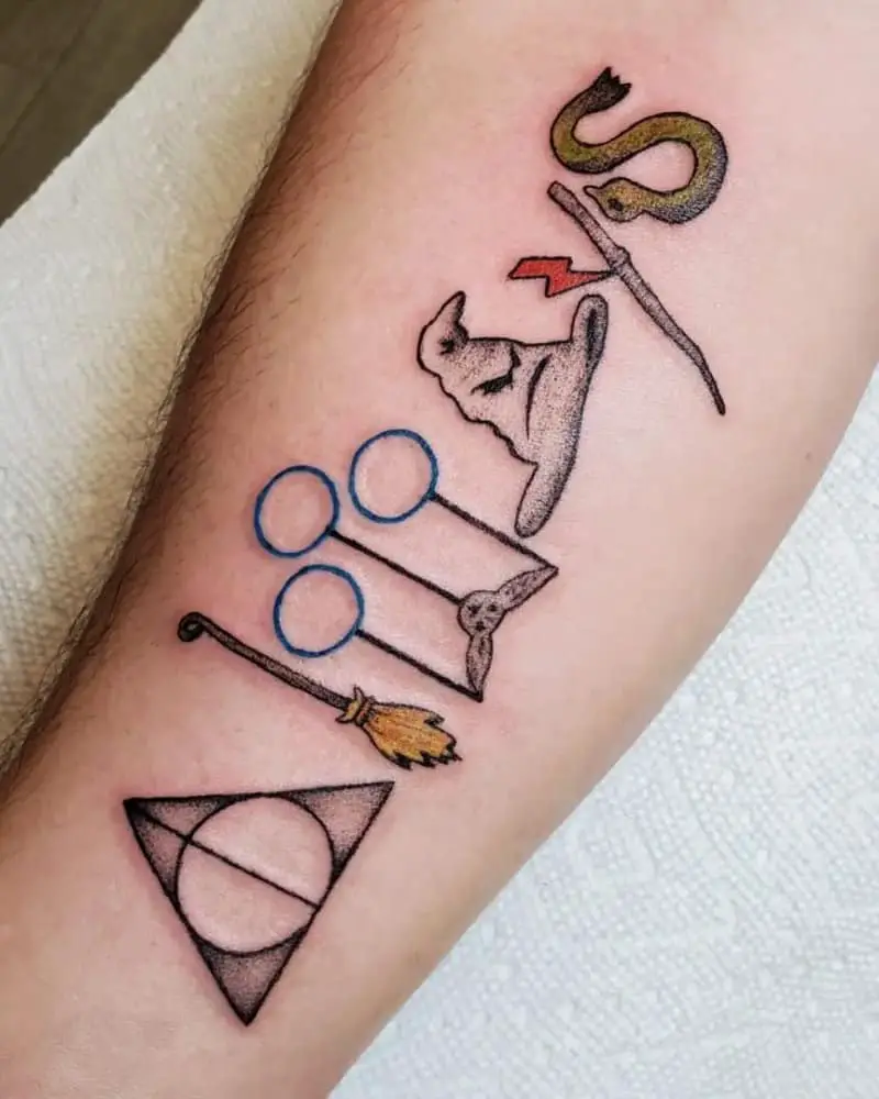 Tattoo inscription Always written with symbols of the Deathly Hallows, broomstick, Quidditch ring, hat, wand and snake