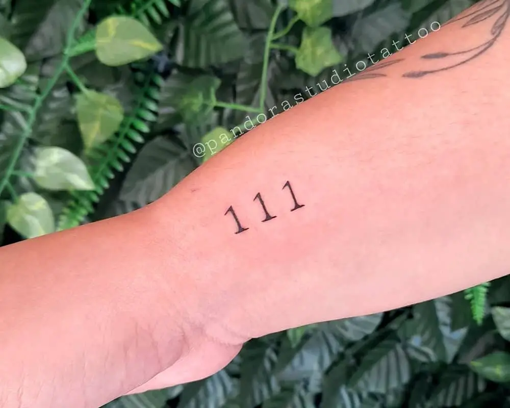 Tattoo of 111 on the arm